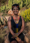 African lady wearing a Zulu beaded necklace, headband and bracelet.