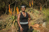 African lady wearing African beaded headbang, belt and necklace